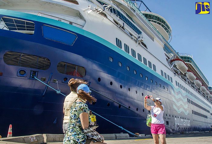 Cruise visitors take pictures after disembarking the MS Monarch, which docked at the Port of Kingston this morning (December 6) with 2,700 passengers on board. The MS Monarch, operated by Royal Caribbean’s Pullmantur Brand, is the largest cruise ship to call at the port. The passengers will be visiting locations in and around Kingston including Port Royal, Devon House and Bob Marley Museum, Emancipation Park, the craft market, and the National Gallery of Jamaica. Visits have also been planned for Spanish Town, St. Catherine and Dunn’s River Falls in St. Ann before the ship departs later in the day.