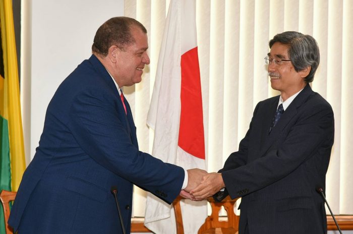 Finance and the Public Service Minister, Hon. Audley Shaw (left), greets Japanese Ambassador to Jamaica, His Excellency Masanori Nakano, at the signing ceremony for the Exchange of Notes and the Record of Discussions, at the Minister’s Heroes Circle offices in Kingston, on October 6.