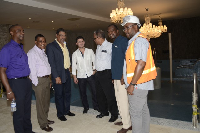 Tourism and Entertainment Minister, Hon. Dr. Wykeham McNeill (3rd left), is joined by Director of Tourism, Mr. Paul Pennicooke (2ndleft)  and Chairman of the Jamaica Tourist Board, Mr. Dennis Morrison (3rd right), at  one of Moon Palace's Spa Pools during a tour of the resort in Ocho Rios, St. Ann, on June 18.  The rehabilitated hotel is slated for a soft opening in July. Others (from left) are: Vice President, Investments and Promotions at Jamaica Promotions Corporation (JAMPRO), Claude Duncan; Vice President of Playa Resorts Management, the Parent company of Moon Palace, Gibran Chapur (centre); General Manager of the hotel, Clifton Reader and a representative of  contractors.