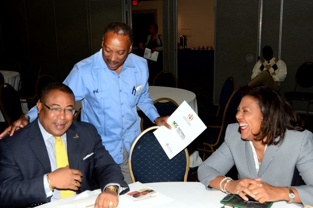 Minister of Industry, Investment and Commerce, Hon. Anthony Hylton (left) , enjoys a light moment with Chairman, Jamaica Promotions Corporation (JAMPRO), Milton Samuda (centre); and Executive Director (Acting)/Legal Counsel, Jamaica Intellectual Property Office, Lilyclaire Ballamy. Occasion was the National Competiveness Council's 5th annual business environment reform roundtable at the Jamaica Pegasus Hotel in New Kingston today (Feb. 26). The roundtable meeting was aimed at promoting collaboration between the private and public sectors to improve the ease of doing business in Jamaica.
