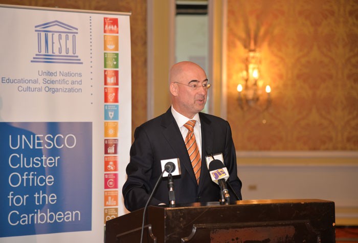 United Nations Resident Coordinator in Jamaica, Bruno Pouezat, addresses the Cluster Meeting for the Caribbean National Commissions for UNESCO, at the Hyatt Ziva Hotel in Rosehall, St. James on Monday, October 26 .