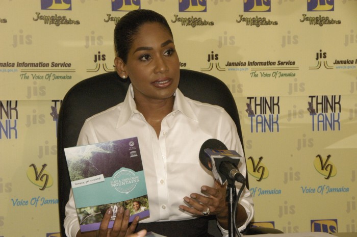 Minister of Youth and Culture, Hon. Lisa Hanna, displays a brochure to be used as part of the public education campaign on the Blue and John Crow Mountains area, recently designated as Jamaica’s first World Heritage Site and the Caribbean’s first World Heritage Mixed (cultural and natural value) Site. Occasion was a JIS ‘Think Tank’ on September 29.