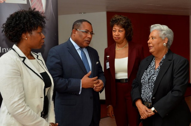 Minister of Industry, Investment & Commerce, Hon. Anthony Hylton (second left), in conversation with (from left), Advisor at the Commonwealth Secretariat, Yinka Bandele; President of Jamaica Promotions Corporation (JAMPRO), Diane Edwards  and President of Jamaica Exporters' Association (JEA), Marjorie Kennedy, at the National Export Strategy (NES) Phase Two Validation Workshop, at the Jamaica Conference Centre, Downtown Kingston, on January 21.