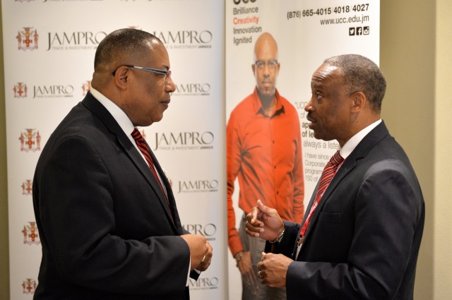 Industry, Investment, and Commerce Minister, Hon. Anthony Hylton (left), is engaged in discussion with Jamaica Promotions Corporation (JAMPRO) Chairman, Milton Samuda, prior to the start of Monday's (June 15) Business Leaders Power Breakfast at Hilton Rose Hall Hotel in Montego Bay, St. James. The breakfast formed part of scheduled activities for the 6th Biennial Jamaica Diaspora Conference, being held from June 13 to 18, at the Montego Bay Convention, under the theme: 'Jamaica and The Diaspora: Linking for Growth and Prosperity'.
