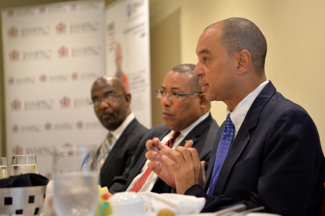 Industry, Investment, and Commerce Minister, Hon. Anthony Hylton (centre), and President, University College of the Caribbean (UCC), Dr. Winston Adams (left), listen to a presentation by GraceKennedy Limited Chief Executive Officer, Don Wehby, during Monday's (June 15) Business Leaders Power Breakfast at Hilton Rose Hall Hotel in Montego Bay, St. James. The breakfast formed part of scheduled activities for the 6th Biennial Jamaica Diaspora Conference, being held from June 13 to 18, at the Montego Bay Convention, under the theme: 'Jamaica and The Diaspora: Linking for Growth and Prosperity'.
