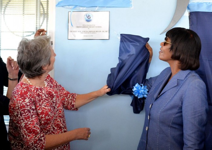 Prime Minister, the Most Hon. Portia Simpson Miller (right); and Head of Delegation for the European Union (EU) in Jamaica, Ambassador Paola Amedei, unveil a plaque at a ceremony to officially open the new state-of-the-art Union Gardens Infant School in South West St. Andrew on Wednesday, January 13. Construction of the school was completed in September last year, through a $174 million public-private investment partnership, which included support of the Jamaica Social Investment Fund, through its EU Poverty Reduction Programme. 