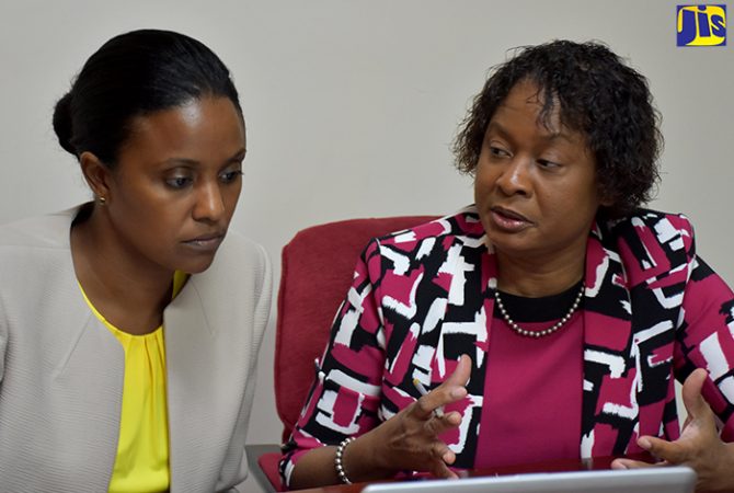 Early Childhood Commission (ECC) Chairperson, Trisha Williams-Singh (left), being updated on sector developments by Acting Executive Director, Karlene Degrasse-Deslandes.