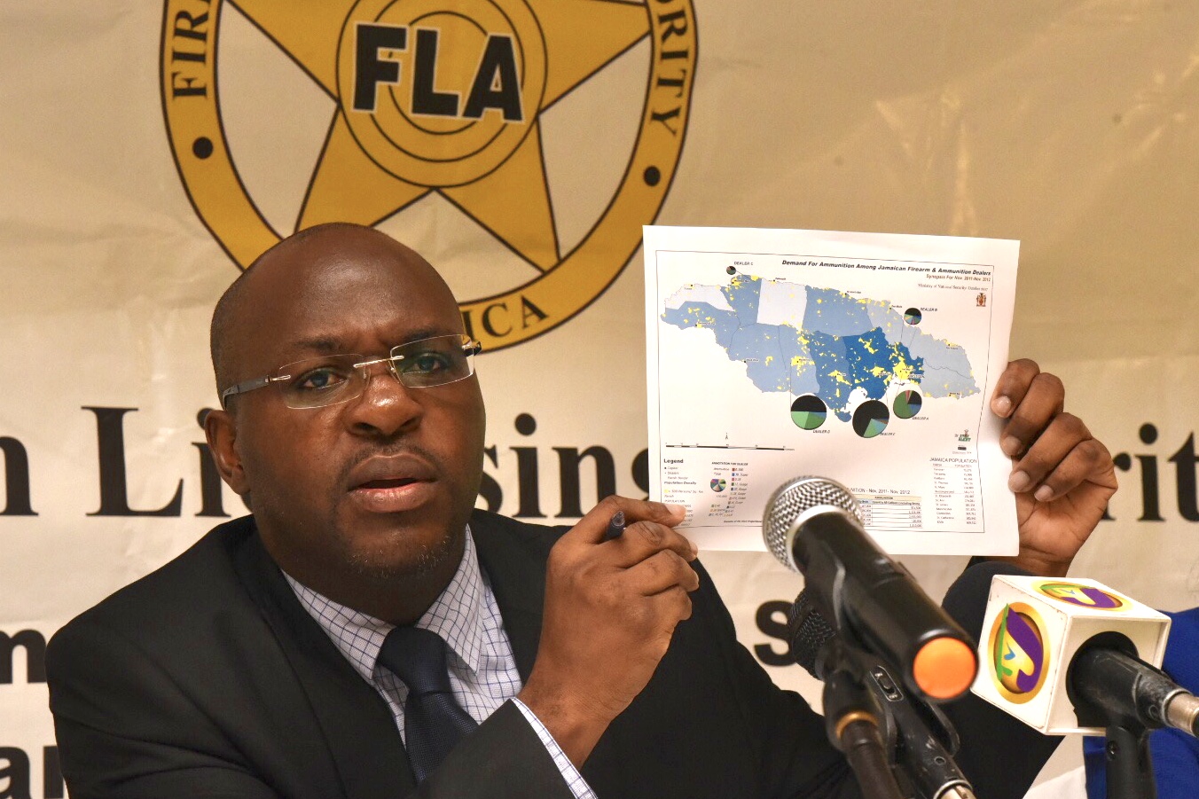 Chief Executive Officer, Firearm Licensing Authority, Shane Dalling, shows a demand map for ammunition among Jamaican firearm and ammunition dealers, during a Press Conference at the Terra Nova All-Suite Hotel in St. Andrew on Friday (July 13).