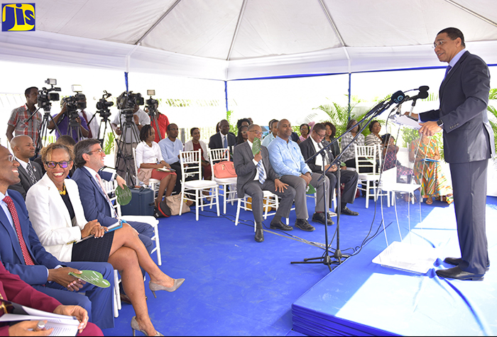 Prime Minister, the Most Hon. Andrew Holness (at podium), addresses attendees at a ceremony for the official opening of the Inter-American Development Bank’s new country office at 6 Montrose Road in Kingston on Thursday (August 9). 