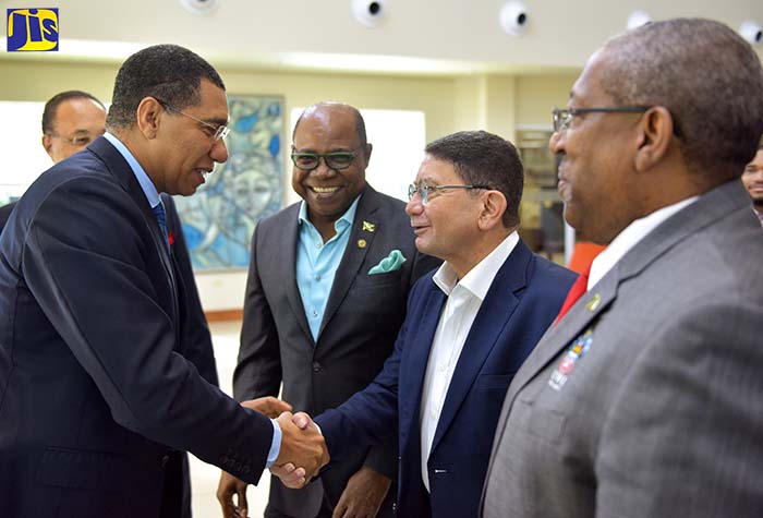 Prime Minister, the Most Hon. Andrew Holness (2nd left), greets former United Nations World Tourism Organization Secretary General, Dr. Taleb Rifai, on arrival at the University of the West Indies (UWI) Regional Headquarters, Mona, St. Andrew, on Thursday (September 13), for the inaugural Tourism Summit of the Americas. Mr. Holness was the keynote speaker at the opening ceremony. Looking on (from left) are: UWI Pro-Vice Chancellor for Global Affairs, Ambassador Dr. Richard Bernal (partly hidden); Tourism Minister, Hon. Edmund Bartlett; and UWI Mona Campus Principal, Professor Dale Webber.