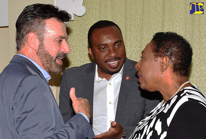 Photo 2
Minister of Culture, Gender, Entertainment and Sport, Hon. Olivia Grange (right), converses with Southern Bureau Chief for the AIDS Healthcare Foundation (AHF), Michael Kahane; and Caribbean Regional Director of the AHF, Dr. Kevin Harvey, at the Advancing Secondary Tertiary Remedial Education for Adolescent Mothers (A-STREAM)  awards ceremony held on Tuesday (September 11) at The Knutsford Court Hotel in New Kingston.
