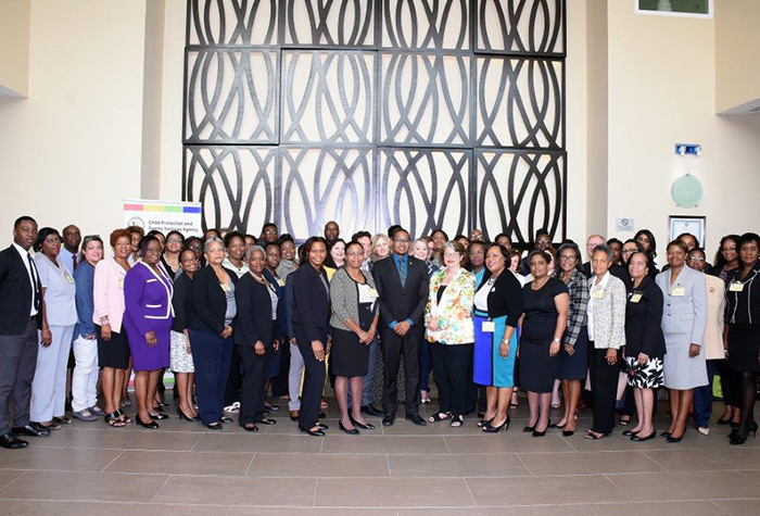 State Minister in the Ministry of Education, Youth and Information, Hon Floyd Green (centre, front row), with  delegates who attended the Caribbean Meeting on International Child Protection, which was held recently at the Courtyard by the Marriott in Kingston.