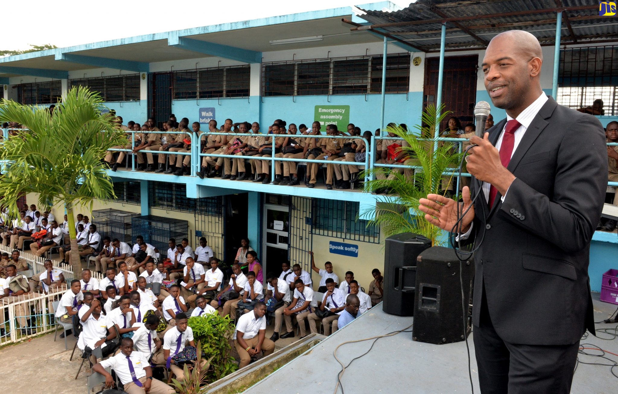 Senior Advisor in the Ministry of Industry, Commerce, Agriculture and Fisheries, Robert Miller, addresses the audience at the St. Catherine-based Enid Bennett High School on Boys’ Day, held at the institution on October 30.