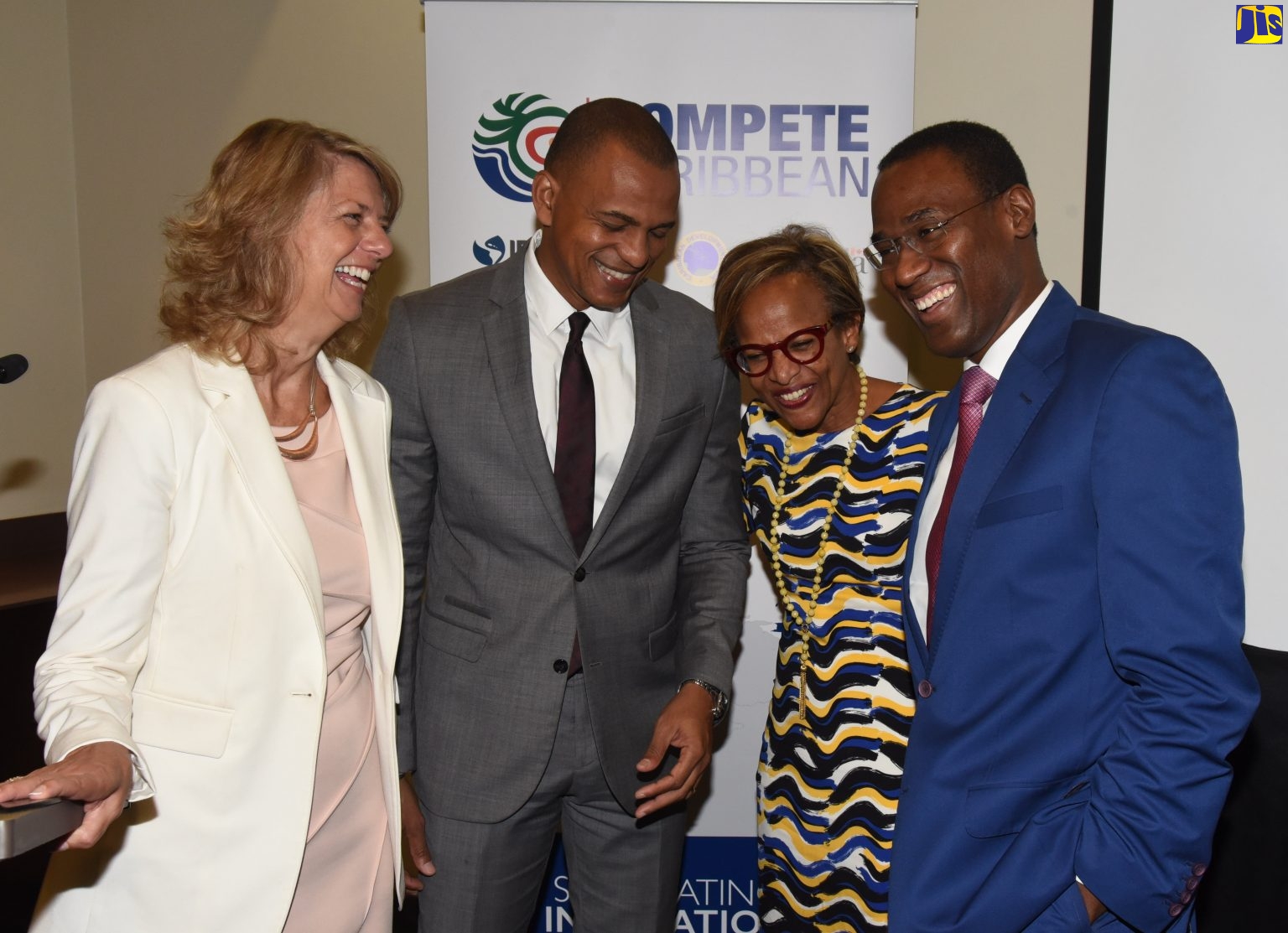 Finance and the Public Service Minister, Dr. the Hon. Nigel Clarke (right), shares a light moment with (from left) Canada’s High Commissioner to Jamaica, Her Excellency Laurie Peters; Caribbean Development Bank (CDB) Director of Projects, Daniel Best;  and Inter-American Development Bank (IDB) Caribbean Department Manager, Therese Turner-Jones, during Tuesday’s (November 20) opening ceremony for the Compete Caribbean Partnership Facility (CCPF) forum at the Marriot Courtyard Hotel in New Kington.