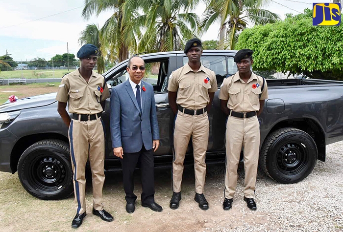 National Security Minister, Hon. Dr. Horace Chang (second  left), along with Jamaica Combined Cadet Force (JCCF) Lance Corporals (from left): Joshané Edwards, Javaughn Levy, and Oswald Williams, during a presentation ceremony for a new vehicle handed over by the Ministry to the JCCF on Wednesday  (October 31). The presentation took place at the JCCF’s Headquarters, Up Park Camp, St. Andrew.