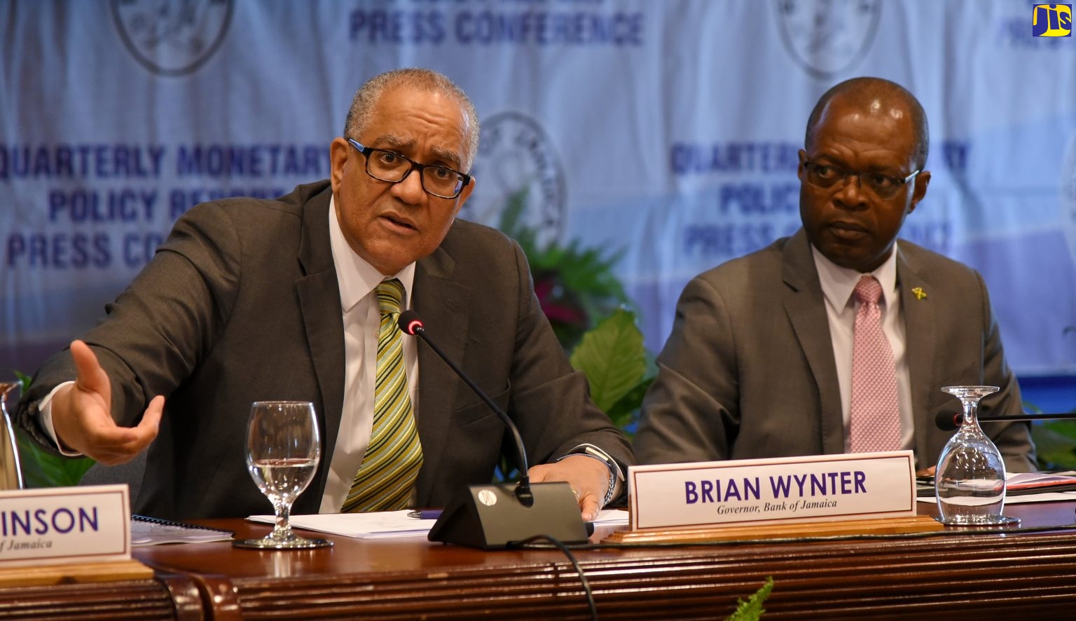 Governor of the Bank of Jamaica (BOJ), Brian Wynter, addresses the quarterly monetary policy report press conference, held at the Bank’s downtown Kingston offices on November 19. At right is Deputy Governor, BOJ, Livingstone Morrison.

