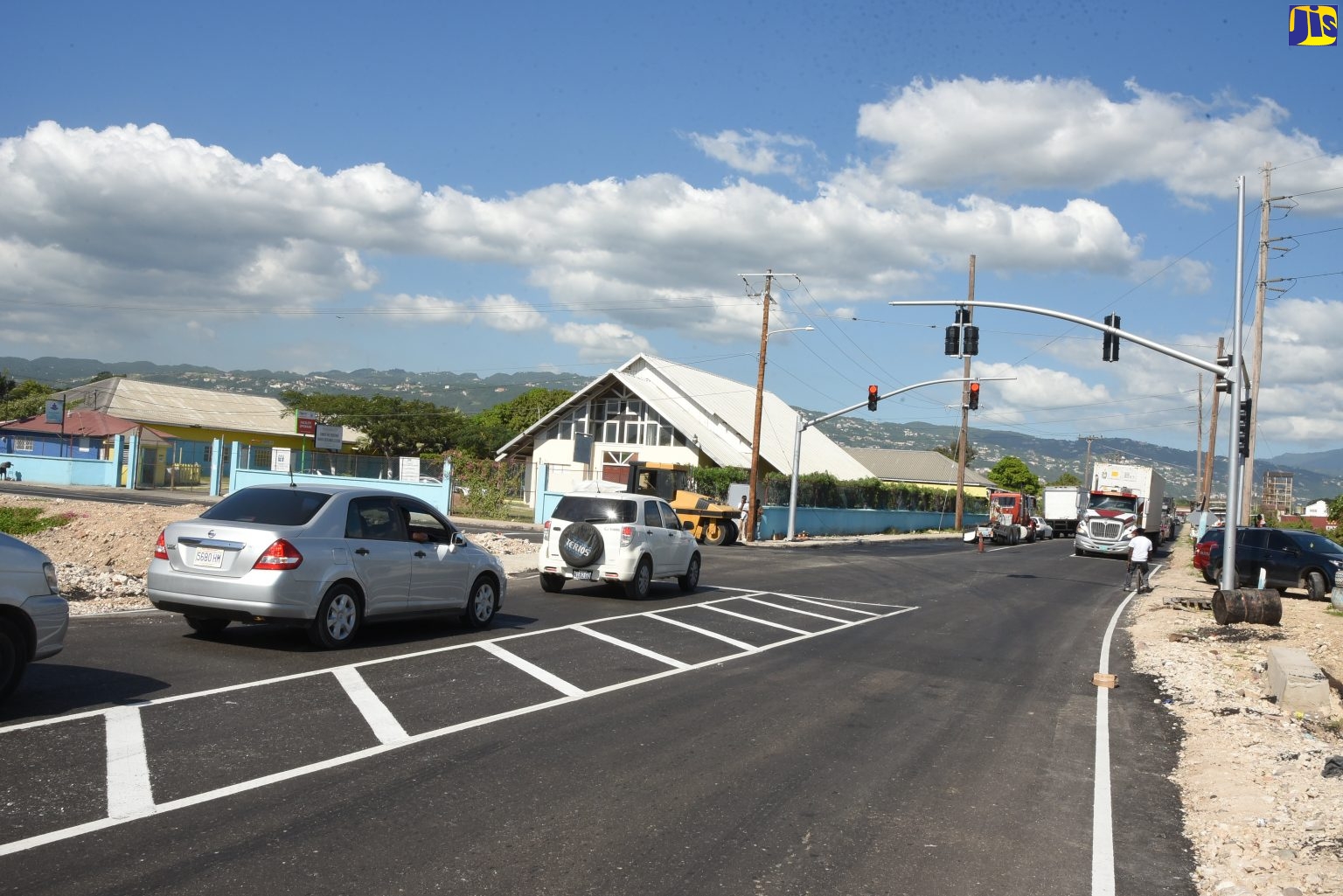 Motorists travel along Chesterfield Drive extension road in St. Andrew, which opened on December 2.