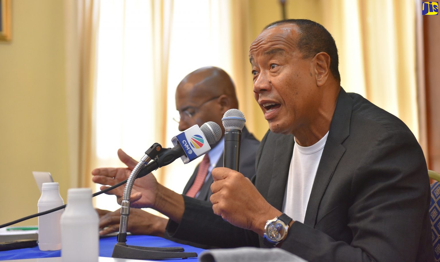 Economic Growth Council (EGC) Chairman, Michael Lee-Chin (right), emphasises a point during the EGC’s media briefing at Jamaica House on Wednesday (Jan. 23). At left is EGC Chief Executive Officer, Senator Aubyn Hill.