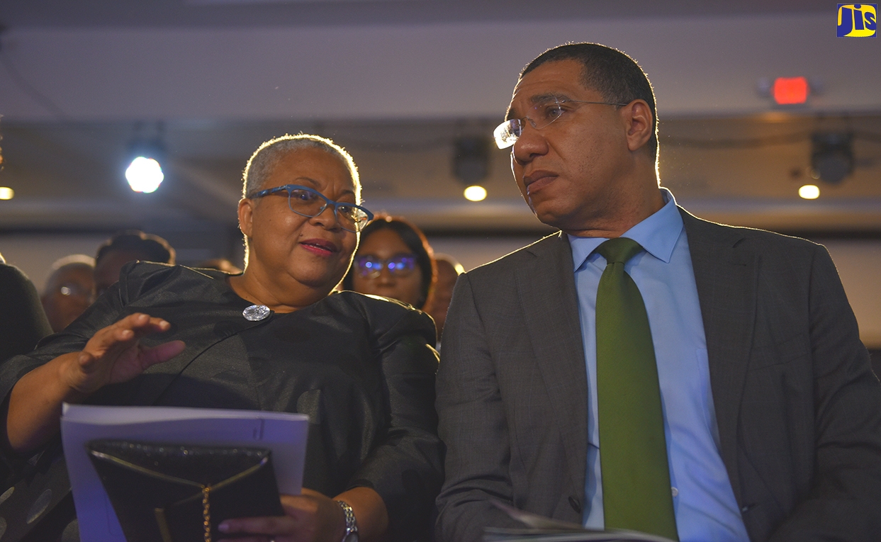 Prime Minister, the Most Hon. Andrew Holness, converses with Jamaica Stock Exchange (JSE) Managing Director, Marlene Street Forrest, during for the JSE’s 14th Regional Investments and Capital Markets Conference at the Jamaica Pegasus Hotel in New Kingston in January.