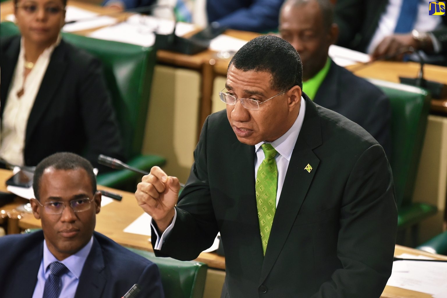 (FILE) Prime Minister, the Most Hon. Andrew Holness, emphases a point at  the 2019/20 Budget Debate in the House of Representatives on March 19.  To his left is Minister of Finance and the Public of Service, Dr. the Hon. Nigel Clarke.
