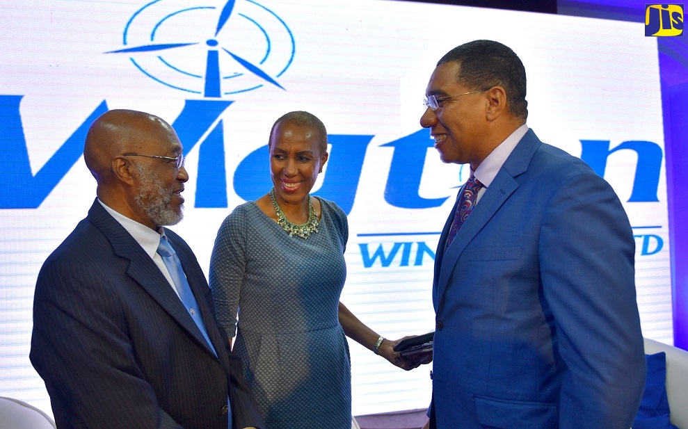 Prime Minister, the Most Hon. Andrew Holness (right), engages with Minister of Science, Energy and Technology , Hon. Fayval Williams (centre) and General Manager of Wigton Windfarms Limited, Earl Barrett,  at Wigton's Initial Public Offering (IPO) Investor Briefing, held at the Montego Bay Convention Centre in Rose Hall, St. James on Friday (April 12).