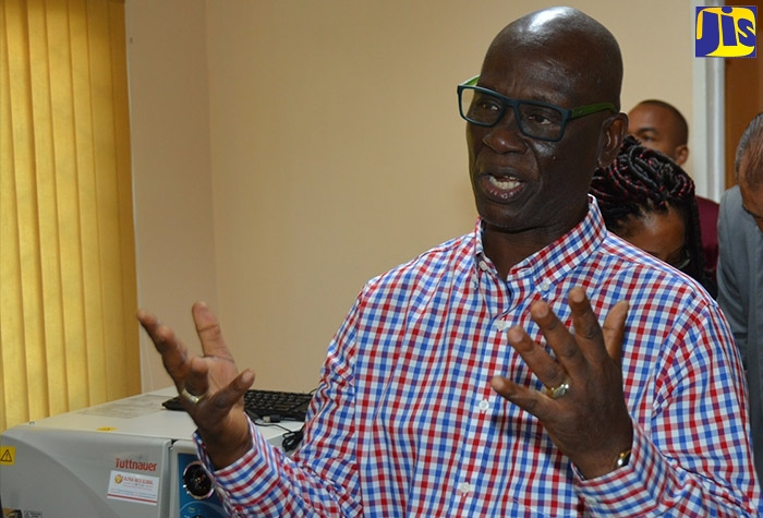 Minister of Local Government and Community Development, Hon. Desmond McKenzie, provides details about water shops being built in St. Elizabeth, at a  recent meeting of the St. Elizabeth Municipal Corporation in Black River.