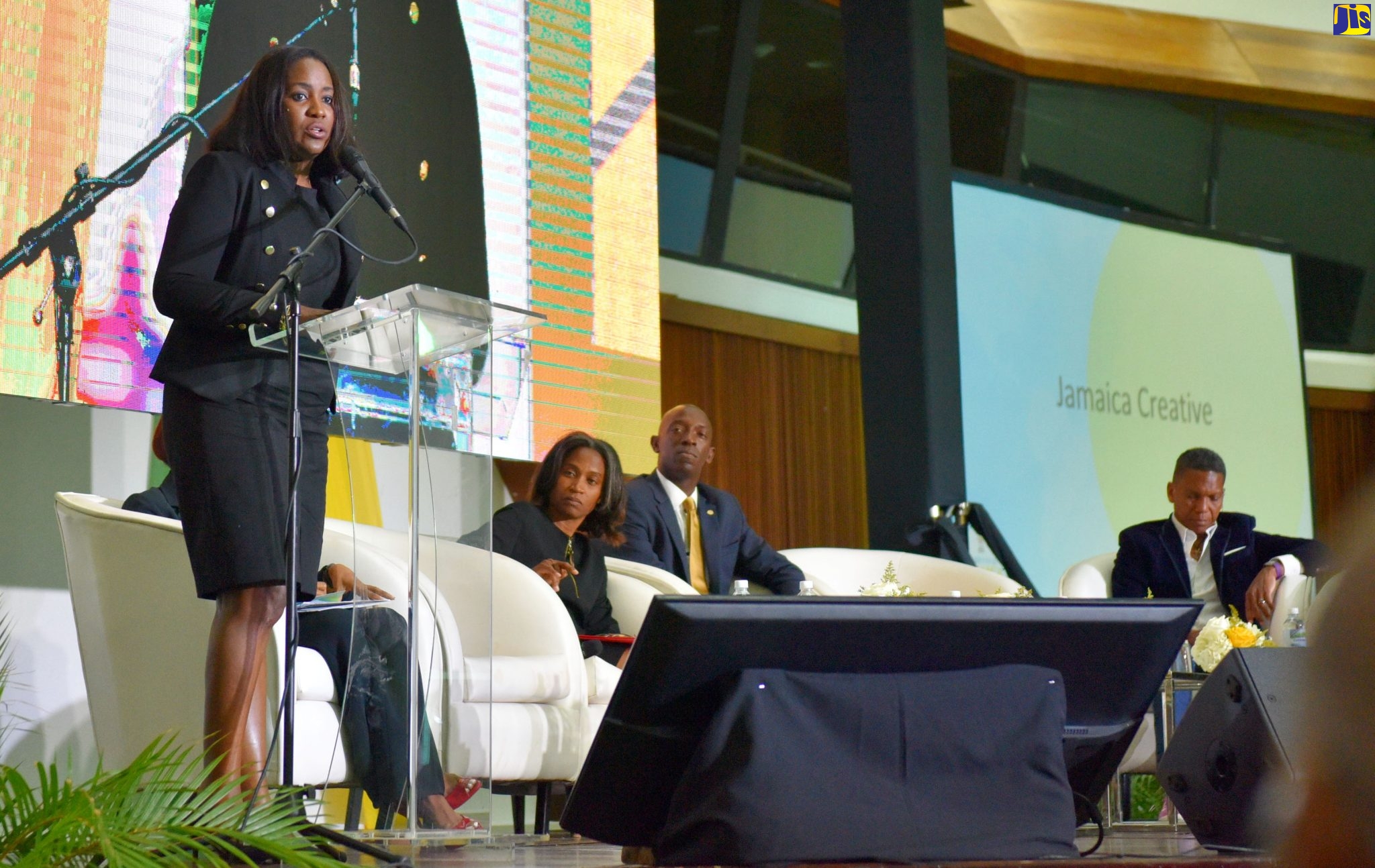 Chief Executive Officer (CEO) of Brand EQ Group Inc., Canada, Nadine Spencer (left), speaks at the Eighth Biennial Diaspora Conference, at the Jamaica Conference Centre in downtown Kingston on June 19. Listening (from second left) are Senior Director, Ministry of Culture, Gender, Entertainment and Sport, Gillian Wilkinson-McDaniel; Mayor of the city of Miramar, Florida, USA, Wayne Messam; and  CEO of Ready TV, Chris Dehring.  

