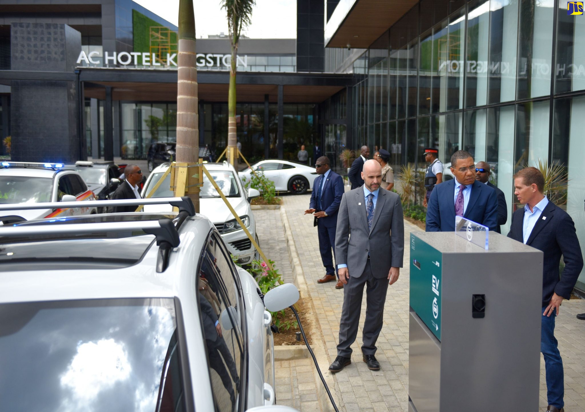Prime Minister, the Most Hon. Andrew Holness (centre), in discussion with Sandals Resorts Group Deputy Chairman, Adam Stewart (right), during a tour of the new AC Marriott Kingston Hotel on Friday (June 14).  Looking on is the Hotel