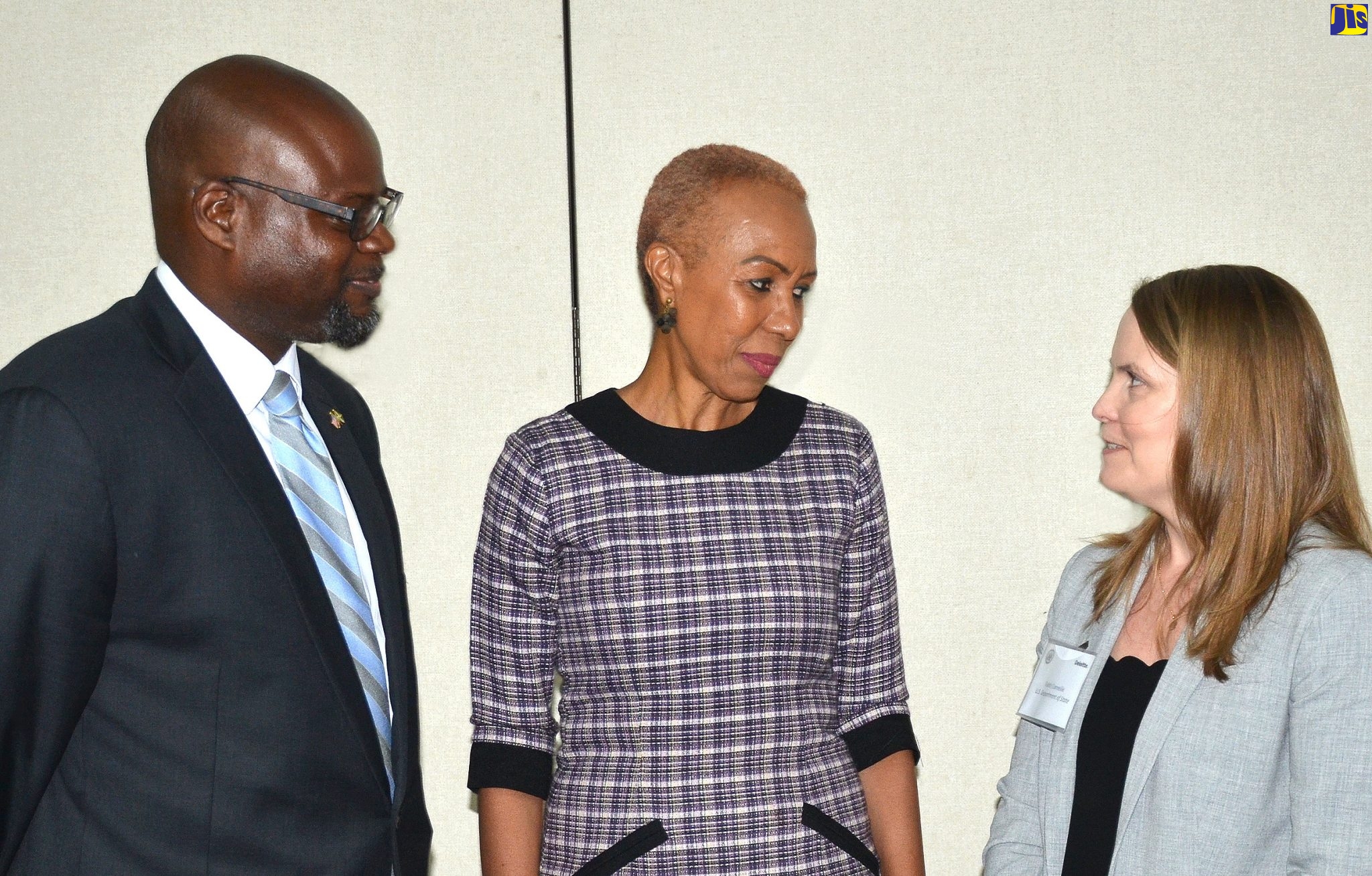 Minister of Science, Energy and Technology, Hon. Fayval Williams (centre), listens to a point from Global Power Sector Programme Manager, Bureau of Energy Resources, United States Department of State, Faith Corneille, at the opening of a two-day alternative energy conference at the Spanish Court Hotel in New Kingston on Monday (July 15). Sharing in the discussion is Country Representative, United States Agency for International Development (USAID), Jason Fraser.