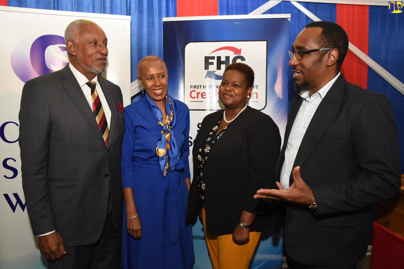 Minister of Science, Energy and Technology, Hon. Fayval Williams (second left), listens to President of the Jamaica Civil Service Association, O’Neil Grant (right),  at the launch of the FHC Civil Servants of the Year Award 2019 and opening of nominations, on Wednesday (August 14), at the Jamaica Co-operative Credit Union League’s Manhattan Road address in Kingston.  Sharing in the moment are Cabinet Secretary and Head of the Civil Service, Ambassador the Hon. Douglas Saunders (left), and Chief Executive Officer, First Heritage Co-Operative Credit Union (FHC), Roxann Linton.

