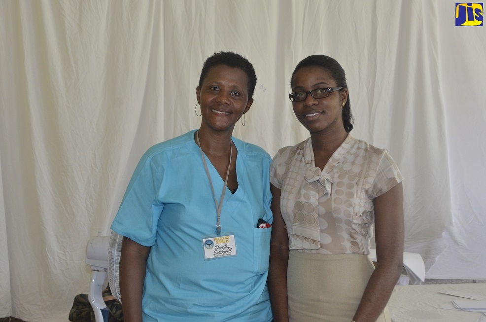 Founder and Chairman for Misty Blue Cancer Foundation, Dorothy Satchwell (left), with Dr. Shebiki Beaton during a free health fair and prostate cancer outreach held at Independence Park, Savanna-la-Mar, Westmoreland on Thursday (September 19).