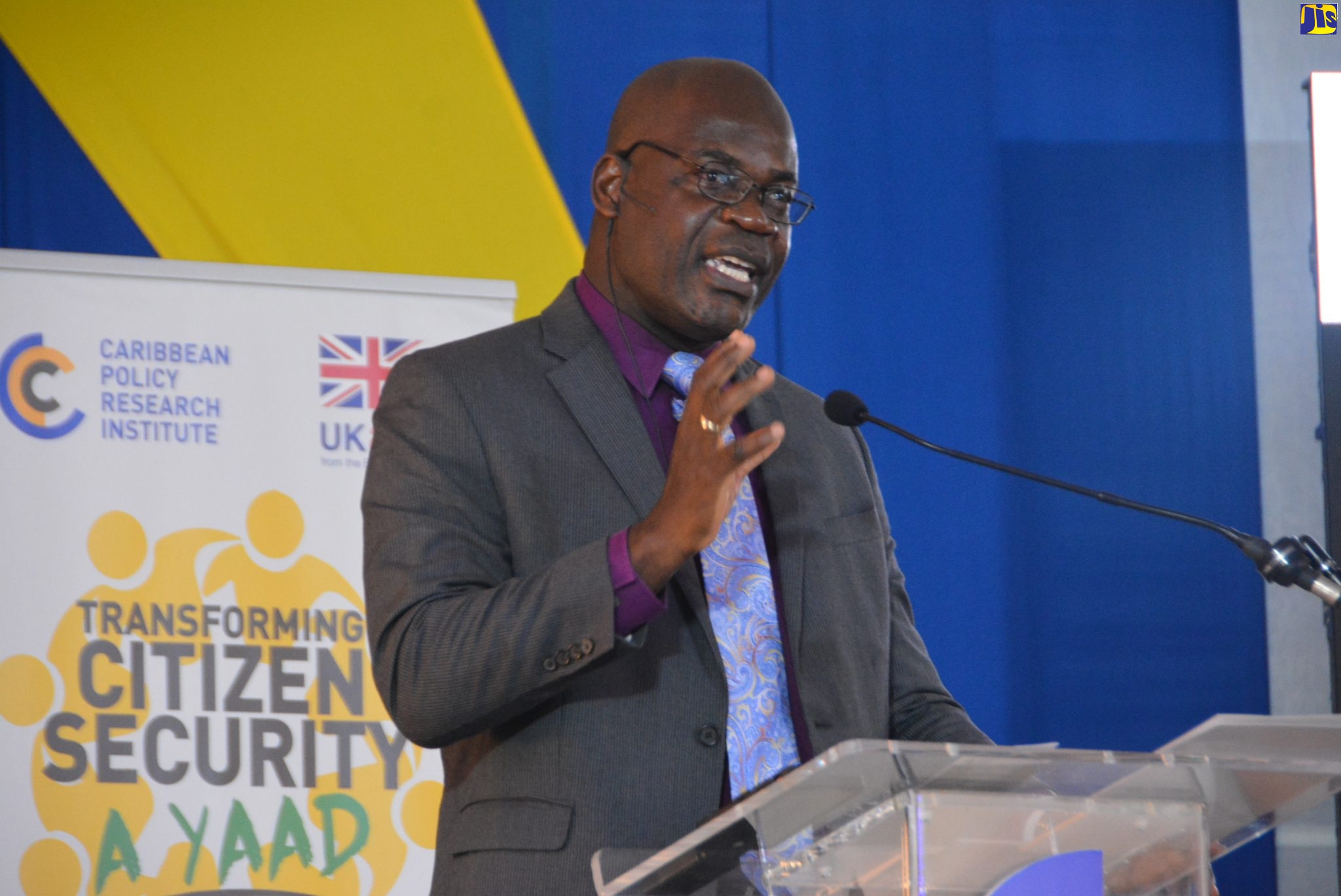 Acting Deputy Commissioner of Police (DCP), in charge of Crime, Fitz Bailey, addresses a forum for the presentation of the Caribbean Policy Research Institute (CAPRI) Report on Scamming, Gangs and Violence in Montego Bay, which was held at the city’s Cultural Centre in St. James on September 23.