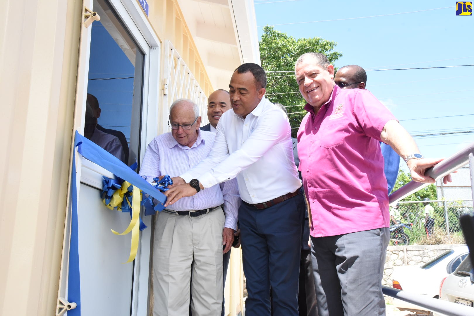 Health and Wellness Minister, Dr. the Hon. Christopher Tufton (centre), and United States Ambassador to Jamaica, His Excellency Donald Tapia (left), officially open the new medical laboratory which was built in Christiana, Manchester at a cost of $20 million. The facility was officially opened on Friday (September 20). Also participating are Industry, Commerce, Agriculture and Fisheries Minister and Member of Parliament for North East Manchester where the lab is located, Hon. Audley Shaw (2nd right); and (from 2nd left) Southern Regional Health Authority Chairman, Wayne Chen; and Director for the Centres for Disease Control and Prevention, Dr. Varough Deyde (partially hidden).