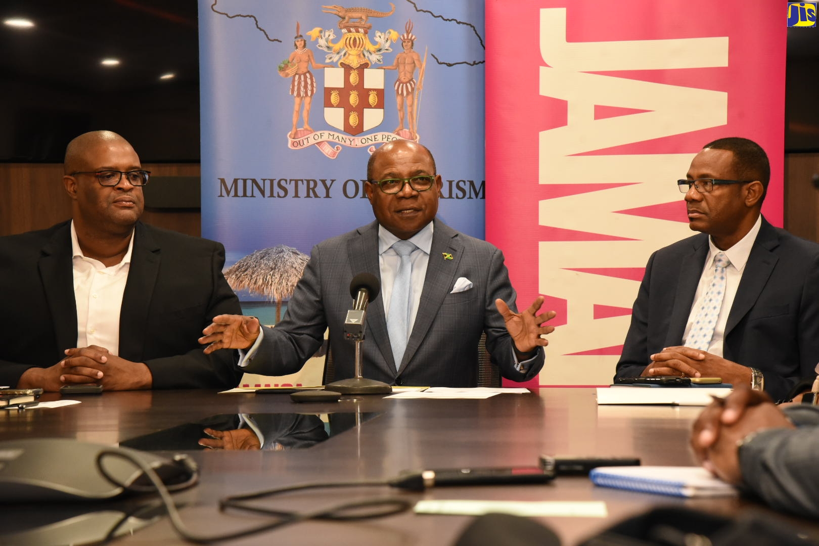Tourism Minister, Hon. Edmund Bartlett, responds to questions from journalists during a media briefing at the Ministry’s New Kingston Corporate Office on Tuesday (September 24). He is flanked by Senior Advisor in the Ministry and Executive Director for the Global Tourism Resilience and Crisis Management Centre, Professor Lloyd Waller; and Senior Director for Technical Services, David Dobson.