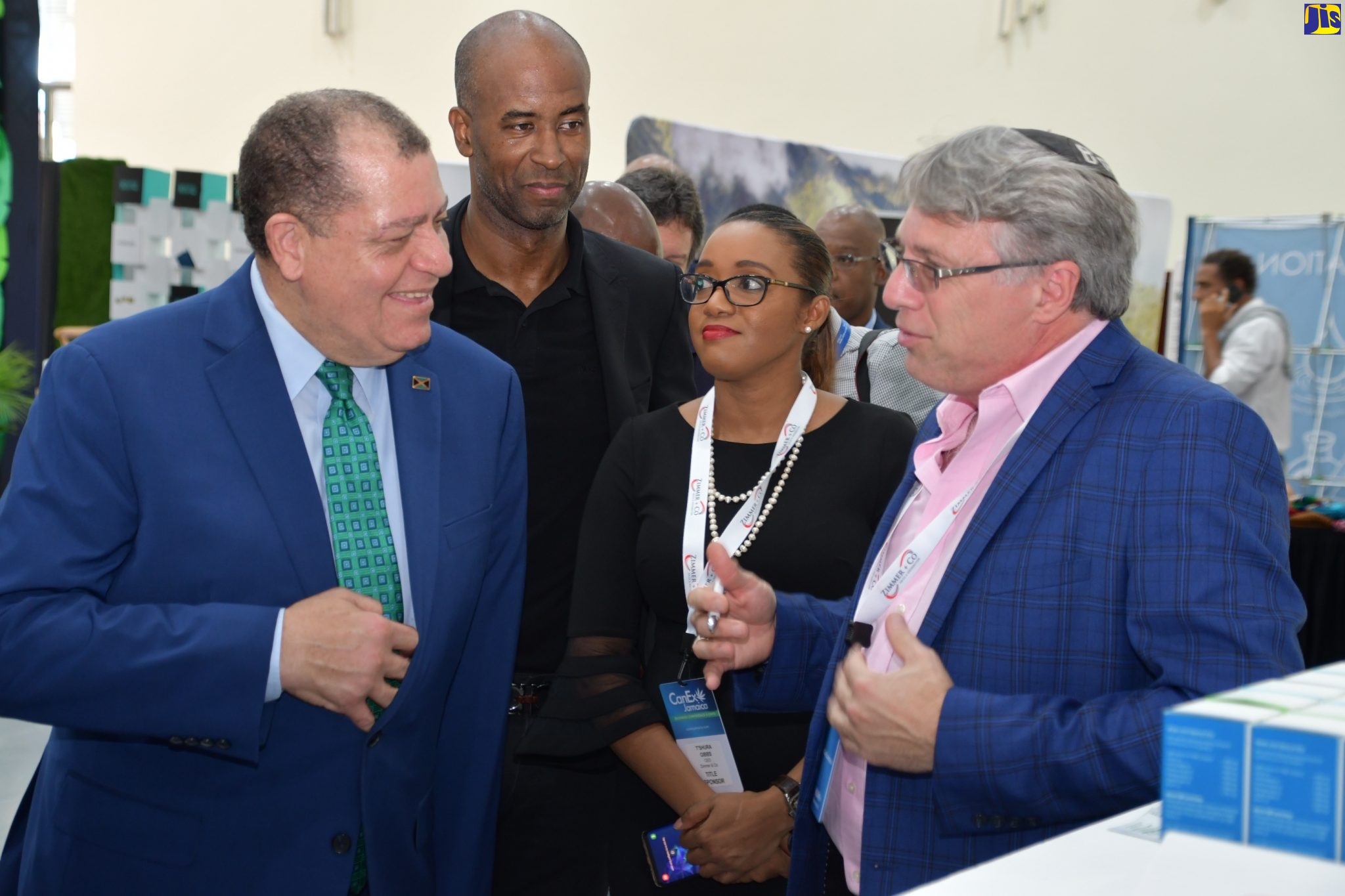 Minister of Industry, Commerce, Agriculture and Fisheries, Hon. Audley Shaw (left) converses with Chief Executive Officer of Abacus Health Products, Perry Antelman (right), during a tour of booths at the opening of the CanEx Business Conference and Expo on Thursday (September 26), at the Montego Bay Convention Centre in St. James. Listening are Founder of the event, Douglas Gordon (second left), and Chief Executive Officer of Zimmer and Company Sales and Distribution, T’Shura Gibbs.
