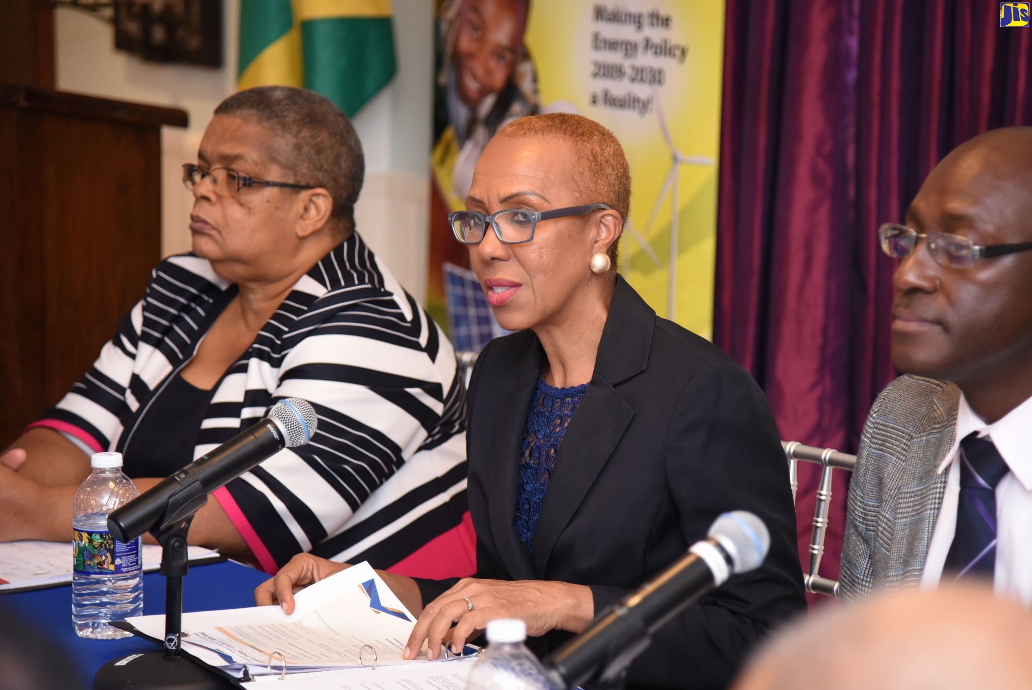Minister of Science, Energy and Technology,  Hon. Fayval Williams (centre), speaks to participants at the Jamaica Energy Council Meeting on Friday (September 13), at Eden Gardens Wellness Resort and Spa, in Kingston. With the Minister are:  Permanent Secretary in the Ministry, Mrs. Carol Palmer (left) and Principal Director, Energy, in the  Ministry,  Mr. Fitzroy Vidal.