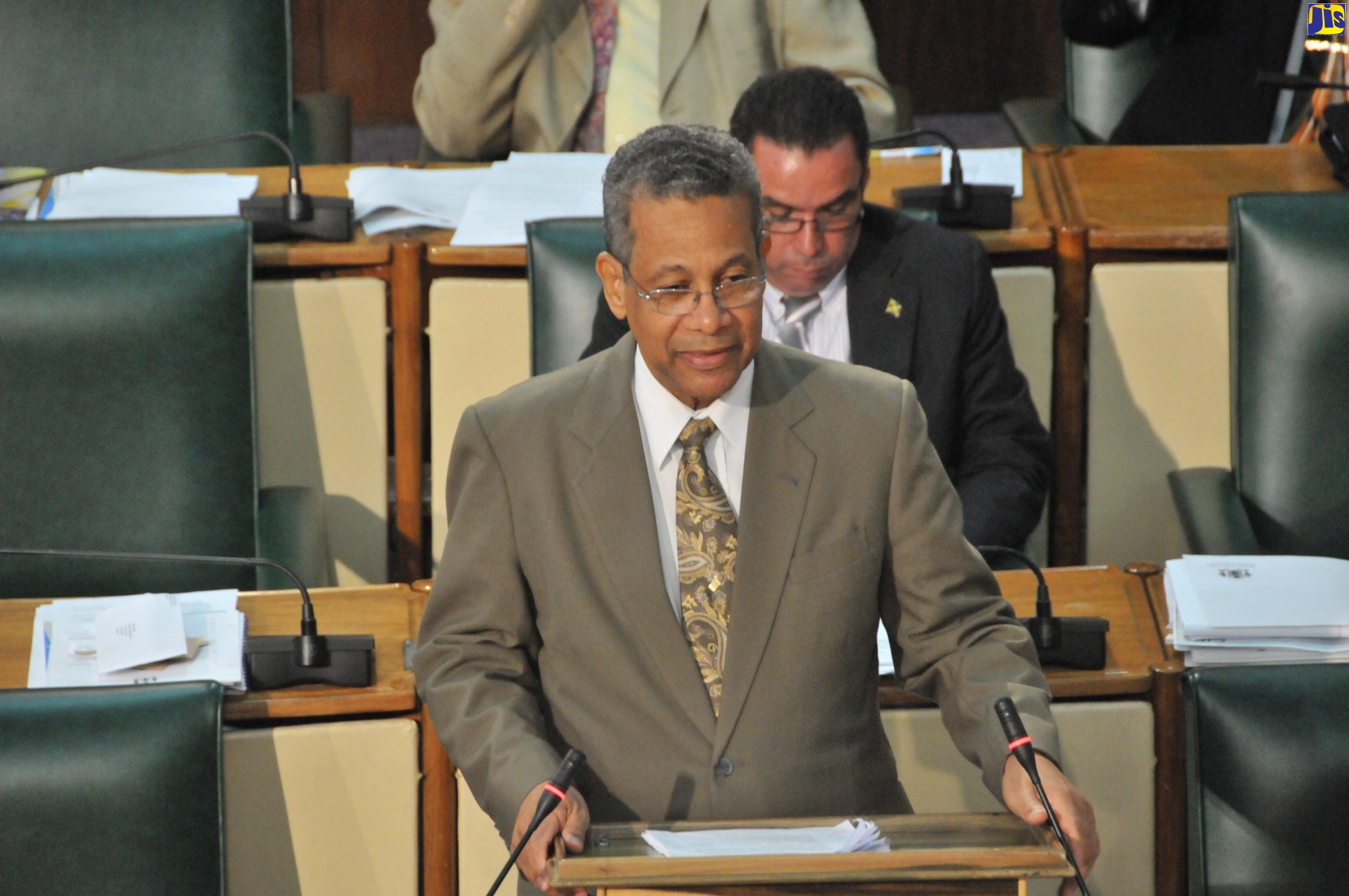 The late former Deputy Prime Minister, Dr. Kenneth Baugh makes a contribution in the House of Representatives during his active years as a politician.