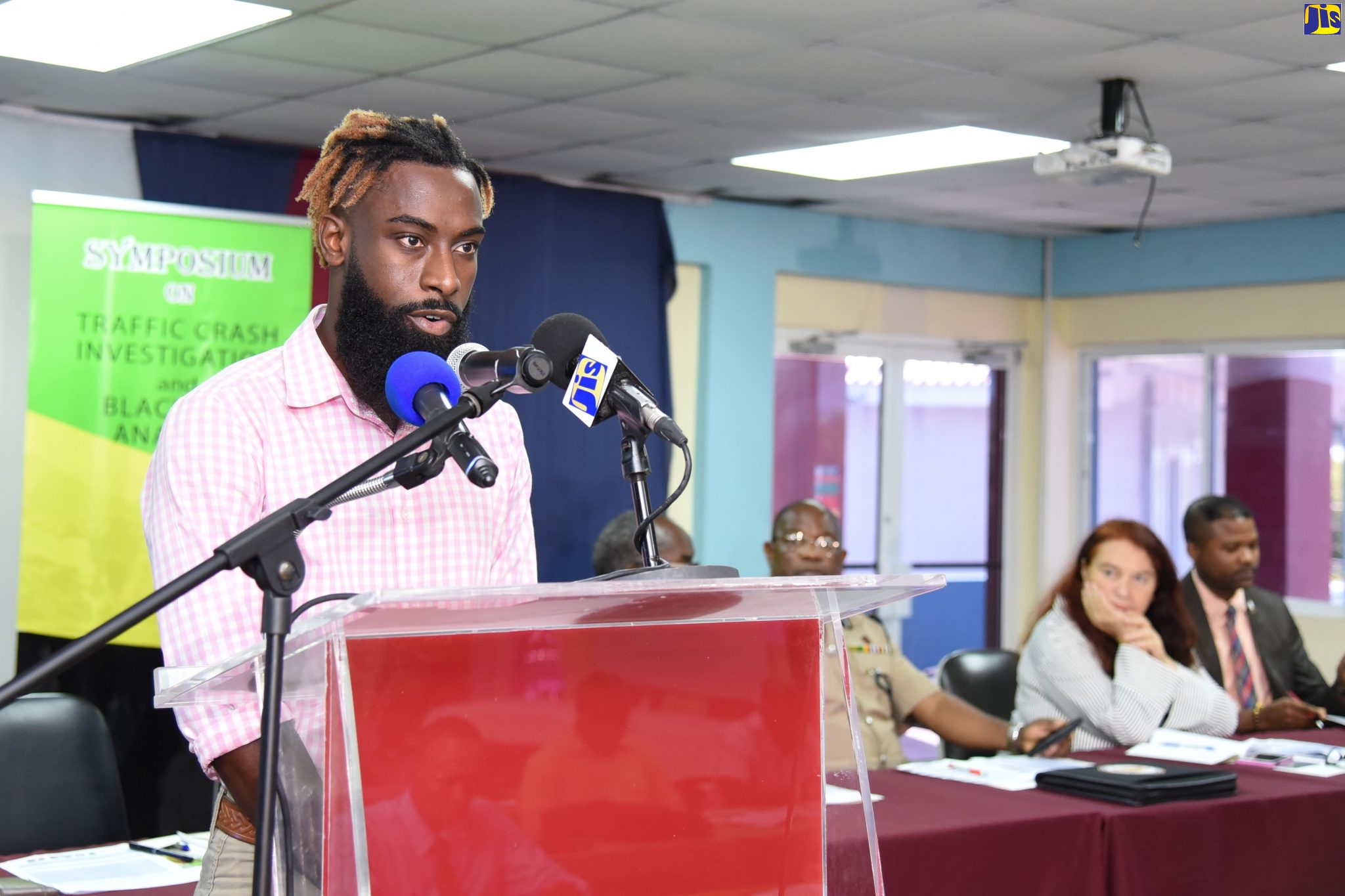 Road safey advocate Maleek Powell speaking at the Ministry of Transport and Mining's inaugural Symposium on Traffic Crash Investigation and Black Box Analysis held at the Caribbean Maritime University (CMU) in August. 