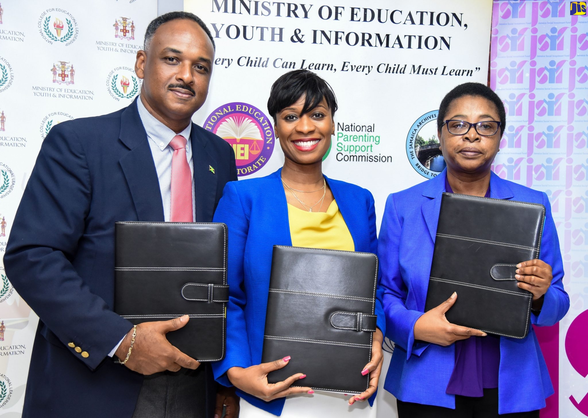 Managing Director, Jamaica Social Investment Fund, Omar Sweeney (left); Director and Principal, National College for Educational Leadership, Dr. Taneisha Ingleton (centre); and Chief Technical Director, Ministry of Education, Youth and Information, Barbara Allen, display folders with copies of the Memorandum of Understanding (MOU) signed on Monday (September 23) at the Ministry of Education, Youth and Information. The MOU makes provision for an Inclusive School Leadership Programme for school administrators.