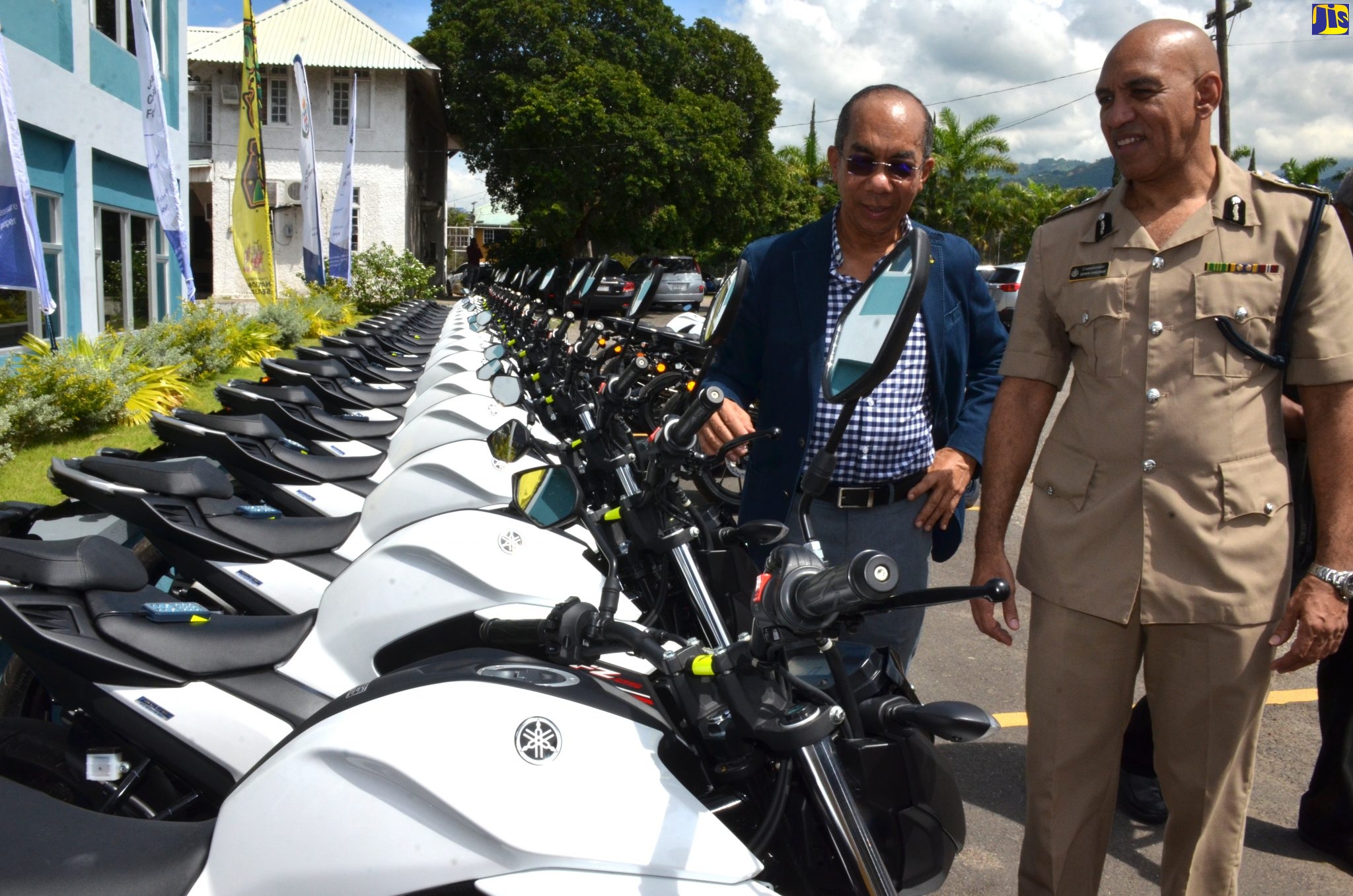 National Security Minister, Hon. Dr. Horace Chang (left), and Police Commissioner, Major General Antony Anderson, inspecting some of the 80 new motorcycles acquired for the Jamaica Constabulary Force’s (JCF) Public Safety and Traffic Enforcement Branch (PSTEB), during a handing over ceremony on Friday (September 20). The presentation was made at the Office of the Commissioner of Police in Kingston.