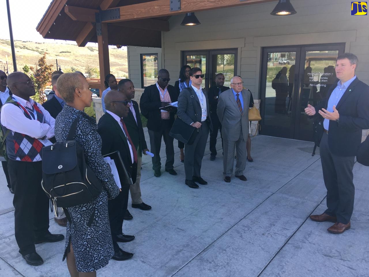 Minister of Science, Energy and Technology, Hon. Fayval Williams; and Principal Director for Energy in the Ministry, Fitzroy Vidal, look at a charging port for an electric vehicle. Occasion was an excursion around sections of Salt Lake City, Utah, on Monday (September 23) to see an electric bus in operation. The Minister is in Utah for a Solar Power International trade show.