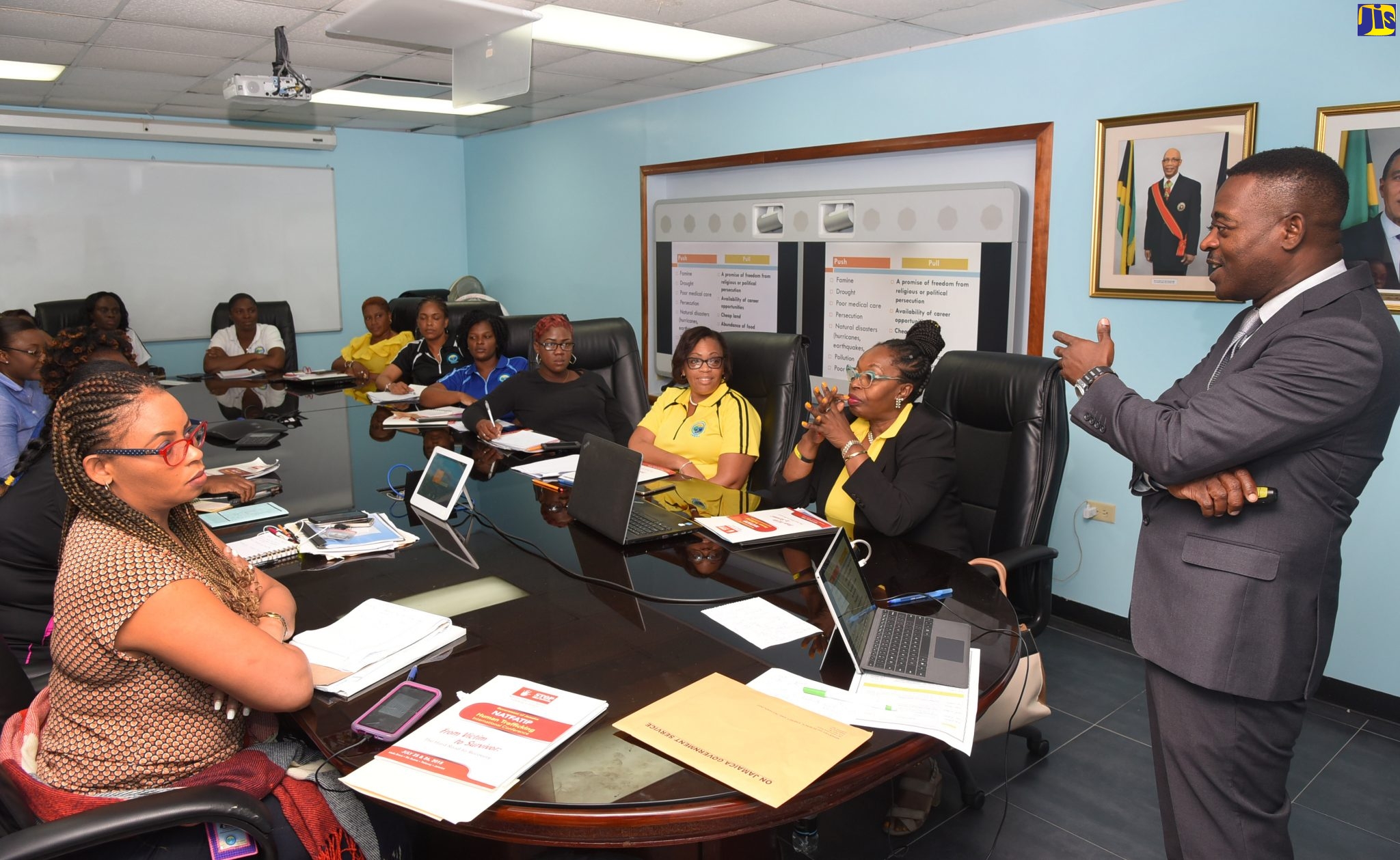 Head of the Anti-Trafficking in Persons Unit in the Jamaica Constabulary Force, Deputy Superintendent Carl Berry (right), conducts an Anti-Trafficking workshop with the Tourism Product Development Company (TPDco) ‘Team Jamaica’ trainers, at TPDCo’s Head Office, Knutsford Boulevard, New Kingston, on September 13.