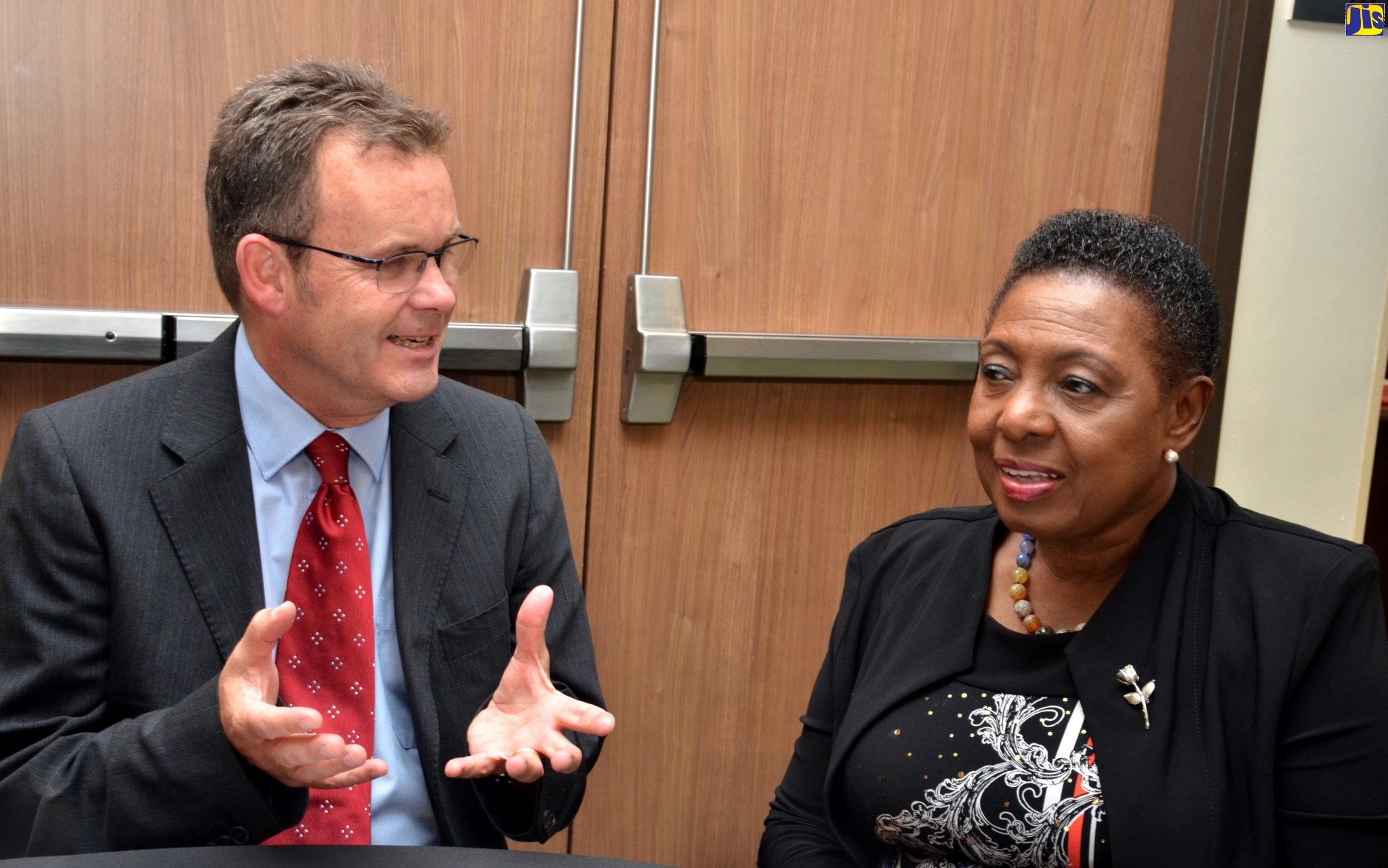 Minister of Culture, Gender, Entertainment and Sport, Hon. Olivia Grange (right), in conversation with Sport Consultant, Commonwealth Secretariat, Andy Preece, at a workshop on ‘Designing a Monitoring and Evaluation (M+E) Framework for Sport Development’,  on Wednesday (September 25), at the Courtyard by Marriot Hotel, New Kingston. The  two-day workshop  will end on September 26.