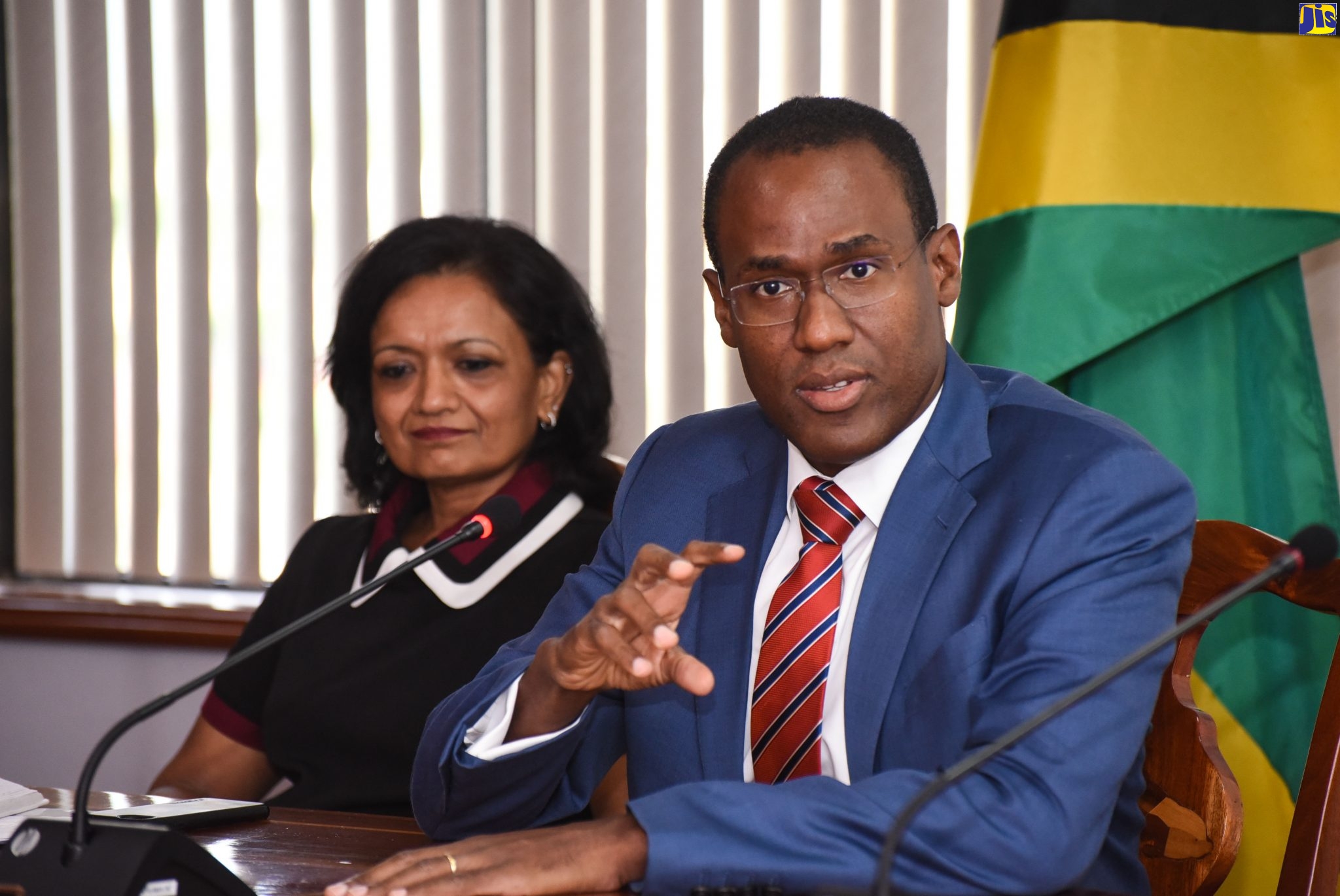 Finance and the Public Service Minister, Dr. the Hon. Nigel Clarke, addresses a recent media round-table forum at the Ministry’s offices in Kingston. Listening is outgoing International Monetary Fund (IMF) Mission Chief to Jamaica, Dr. Uma Ramakrishnan.

