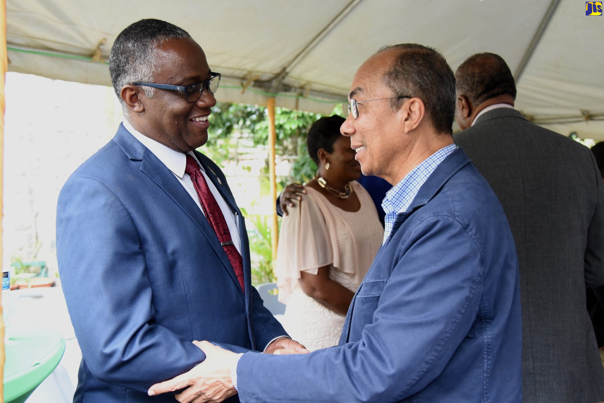 National Security Minister, Hon. Dr. Horace Chang (right),  greets Custos Rotulorum of Manchester, Hon. Garfield Green, at a meeting with business leaders and security personnel from Clarendon, Manchester and St. Elizabeth. The event was held on Sunday (October 27), in Mandeville.
