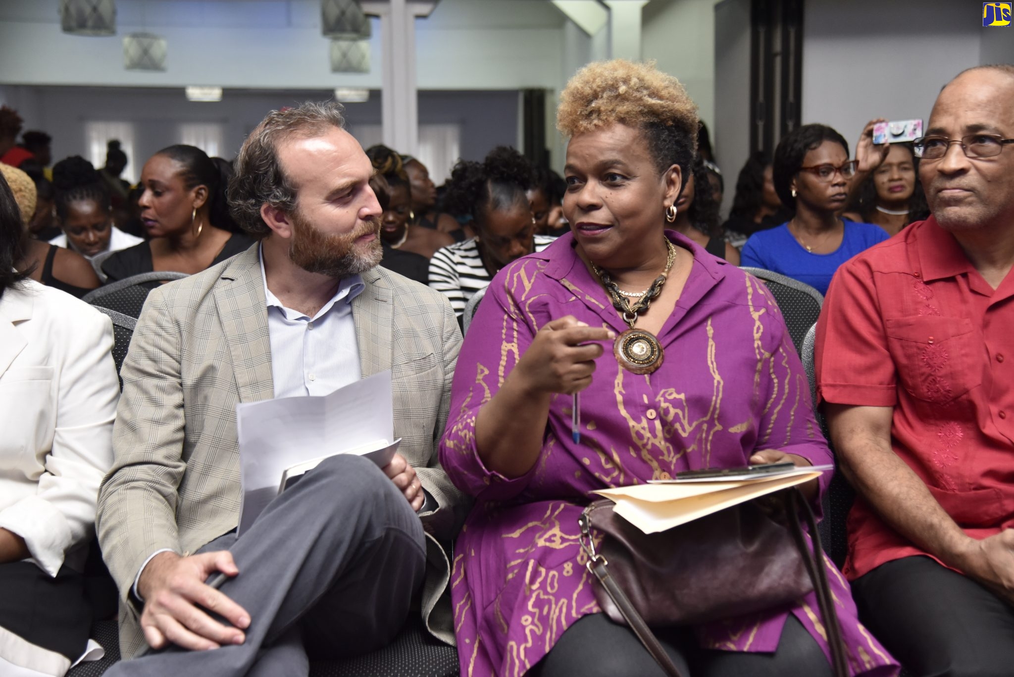 Permanent Secretary in the Ministry of National Security, Dianne McIntosh (centre), converses with Inter-American Development Bank Representative, Francesco De Simone (left), during the Parenting Education Programme graduation exercise, at the Spanish Court Hotel in New Kingston on October 24. At right is Programme Manager, CSJP III, Orville Simmonds. The Parenting Education Programme was implemented by the Citizen Security and Justice Programme (CSJP) III.