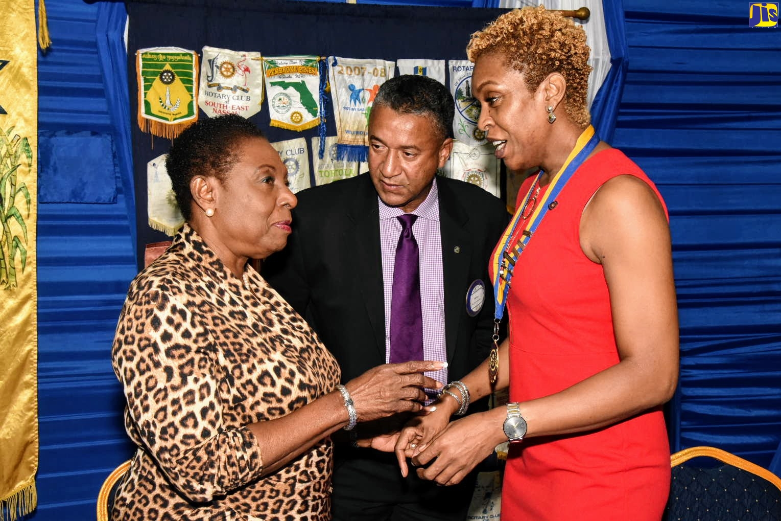 Minister of Culture, Gender, Entertainment and Sport, Hon. Olivia Grange (left), in discussion with (from second left), Past President of the Rotary Club of Spanish Town, Roy Lafayette; and President of the club, Gail Dixon, shortly before the start of a meeting of the club at the Police Officers’ Club in St. Andrew, on Tuesday (October 15). Minister Grange was guest speaker at the event.