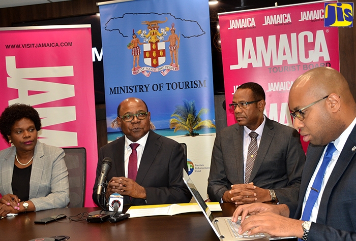 Tourism Minister, Hon. Edmund Bartlett (second left), responds to questions from journalists during a media briefing at the Ministry’s New Kingston offices, on Tuesday (October 1). With the Minister (from left) are Permanent Secretary in the Ministry, Jennifer Griffith; Senior Director for Technical Services, David Dobson; and Senior Strategist, Delano Seiveright.