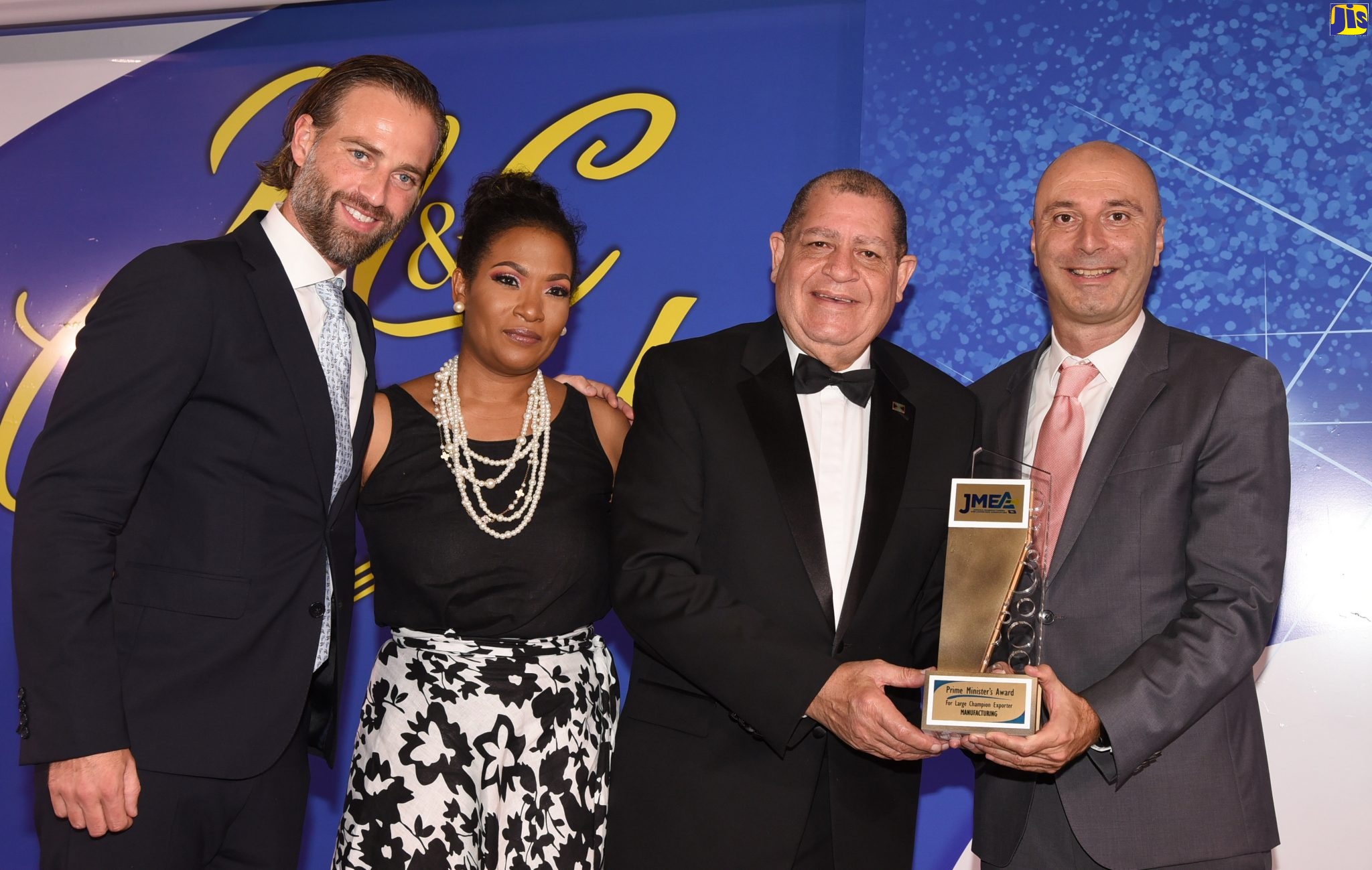 Minister of Industry, Commerce, Agriculture and Fisheries, Hon. Audley Shaw (2nd right) presents the Prime Minister