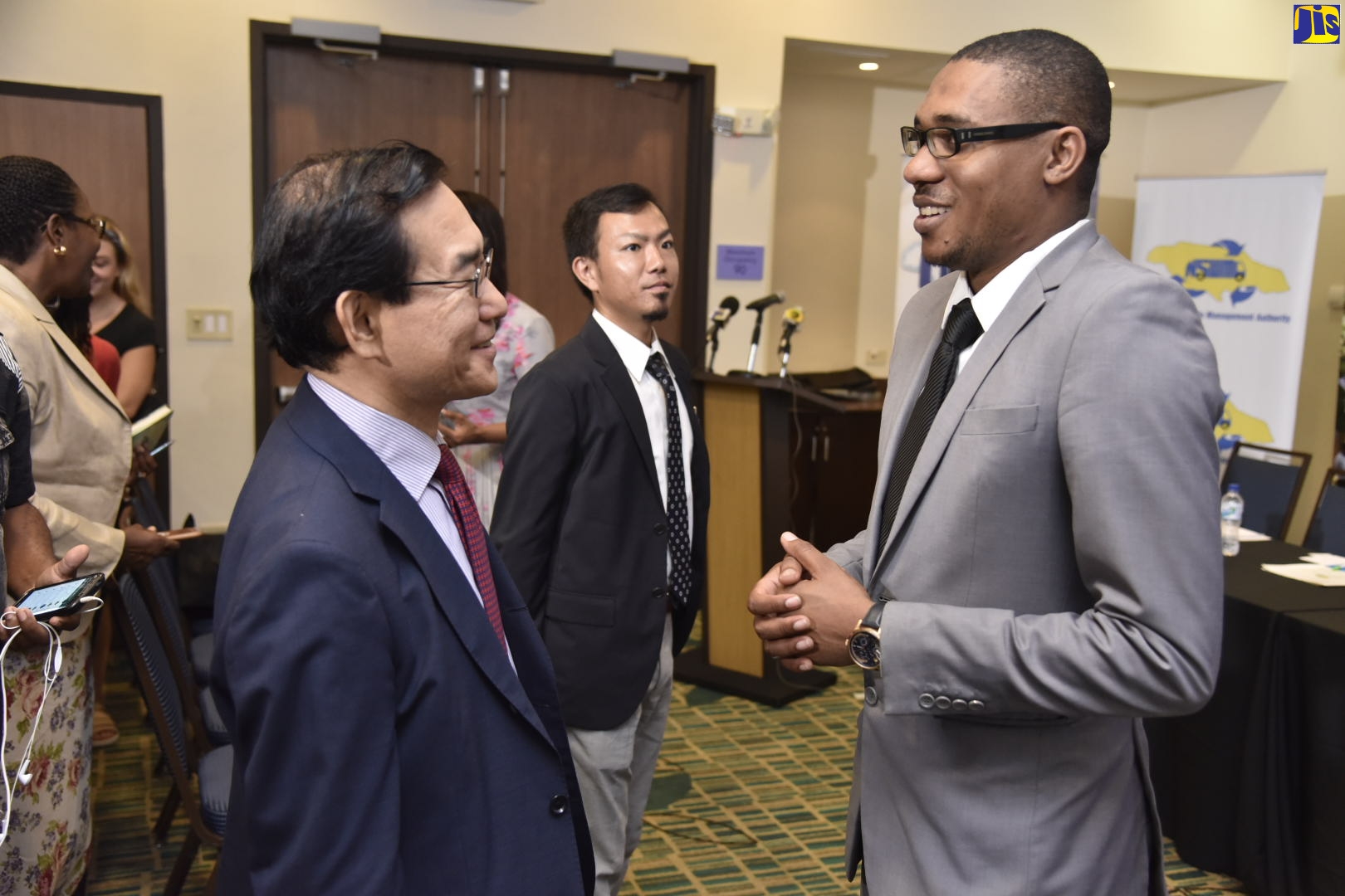 Resident Representative of the Japan International Cooperation Agency (JICA), Takeshi Takano (left), in conversation with Planning Manager, National Solid Waste Management Authority (NSWMA), Edson Carr, at the launch of the Rae Town plastic recycling pilot project on October 30, at the Courtyard by Marriott, in Kingston. The project seeks to reduce the volume of waste entering the Kingston Harbour and provide income-generating opportunities for community members. 
